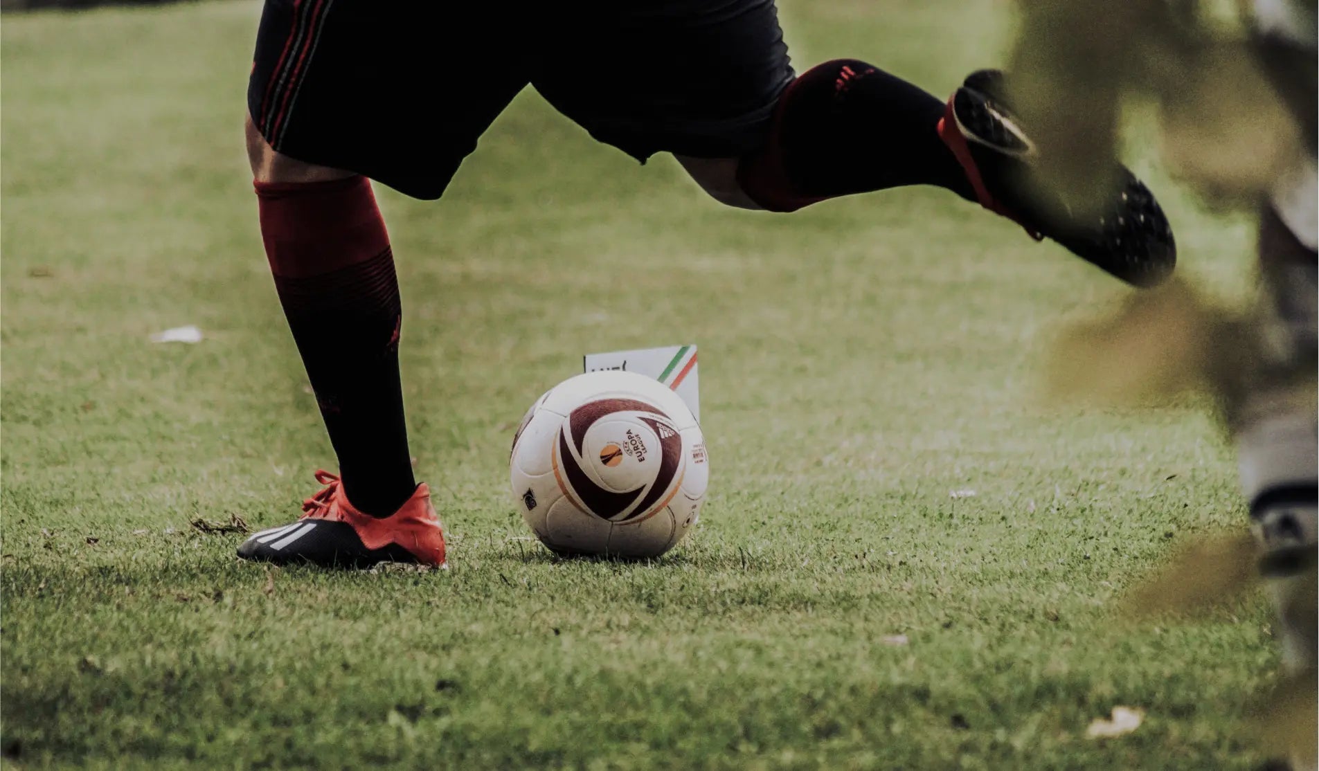 Close up on the feet of a man playing walking soccer