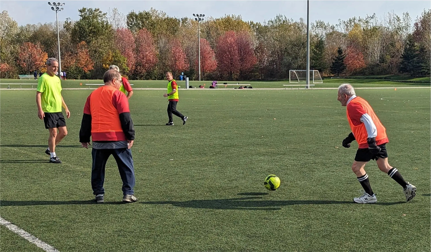 Toronto walking soccer players playing a practice game on turf